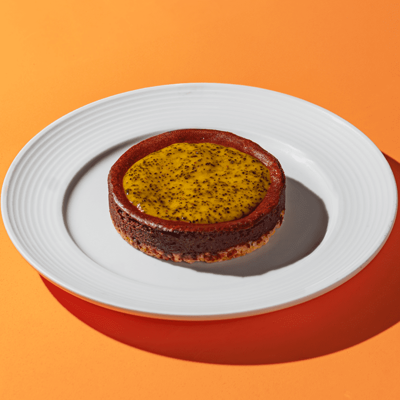 Cheesecake de chocolate 70% com cobertura de maracujá